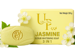 "Ultra Pure Jasmine Whitening Soap with floral petals on pink background. Oval-shaped herbal soap bar with visible natural ingredients for glowing skin, placed beside fresh jasmine flowers."